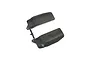 Two black plastic Kyosho mud guards attached to a small plastic sprue on a white background.