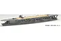 A 1/700 scale plastic model of the IJN Kaga aircraft carrier, fully assembled and painted, shown from a high-angle side view against a white background.