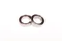 Two metal shielded ball bearings placed side-by-side on a plain white background.