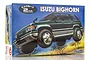 Fujimi 1/24 scale Isuzu Bighorn plastic model kit box featuring an illustration of a green SUV driving off-road.