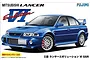 Box art for a Fujimi 1/24 scale Mitsubishi Lancer Evolution VI GSR plastic model kit featuring a blue car illustration.