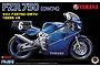 A studio product image of a 1/12 scale Fujimi model kit of the 1985 Yamaha FZR750 OW74 racing motorcycle, featuring a blue and yellow livery.