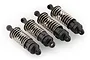 A set of four black plastic RC shock absorbers with silver metal coil springs arranged diagonally on a white background.