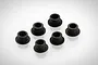 Six small black flanged steering hub bushings arranged on a white background.