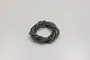A coil of translucent smoke grey silicone fuel tubing for RC models, isolated on a plain white background.