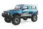 Hobby Plus CR-18 Rushmore RC rock crawler in metallic blue, featuring a detailed off-road body, black trim, and aggressive tread tires on a white background.