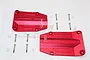 Two red anodized aluminium centre skid plates for an RC car, including mounting screws and plastic spacers, displayed on a white background.