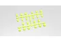 A sprue of fluorescent yellow Kyosho suspension arm pin brace insert bushings on a plain white background.