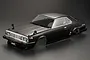 A black 1/10 scale RC car body shell of a 1980 Nissan Skyline Hardtop 2000 Turbo GT-ES, shown from a high-angle front three-quarter view.