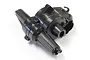 A black plastic gear box case for the Kyosho 1/10 Outlaw Rampage RC vehicle, shown from a high-angle studio perspective.