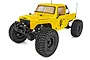 Element RC Enduro Ecto 1/10 scale RC rock crawler in yellow, featuring a pickup truck body, off-road tires, and a front winch.