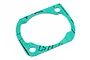 A green paper gasket for an RC engine cylinder head on a white background.