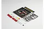 Killerbody 1/10 scale touring car engine accessory kit including a pre-painted engine bay insert, plastic parts tree, decals, and mounting hardware.