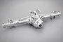 A silver aluminium rear differential and axle housing for the Traxxas UDR, featuring a metallic finish and mounting points.