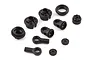 A set of black plastic RC shock absorber components including spring retainers, rod ends, and shock caps on a white background.