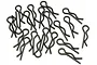 A collection of twenty black metal R-clips or body pins for RC car bodies scattered on a white background.