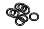 A pile of eight black silicone O-rings arranged on a white background.