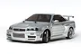 A silver Tamiya Nismo Skyline GT-R R34 Z-Tune RC drift car model on a white background.
