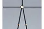 A black RC scale model safety harness with gold-coloured metal buckles laid out on a grey surface.