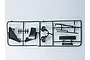 A black plastic parts tree containing various RC car accessories, including side mirrors and trim pieces, on a plain white background.