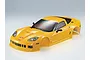 A yellow Killerbody 1/10 scale Corvette GT2 RC car body shell, featuring detailed headlights, side mirrors, and tinted windows on a plain background.