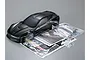 Killerbody 1/10 scale black Corvette GT2 RC car body shell with included decal sheet, instruction manual, and plastic accessory parts in bags.