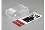 A clear polycarbonate RC truck hood and fender set with a decal sheet and two strips of double-sided adhesive tape on a grey background.