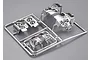 A chrome-plated plastic sprue containing light bucket parts for a 1/10 scale RC car model.