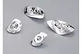 Four chrome-finished plastic light bucket components for a 1/10 scale RC car body, arranged on a grey background.