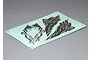 A sheet of Killerbody 1/10 scale crawler decals featuring dark grey abstract mountain or terrain patterns on a light blue backing paper.