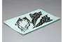 A sheet of black graphic decals on a light blue backing paper, featuring abstract jagged patterns for RC crawler bodies.