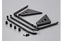 A set of black plastic RC truck parts including roll bar components, side panels, small spacers, and screws on a grey background.