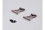 Two grey aluminium RC rear wing mounts with a small pile of black screws on a light grey background.