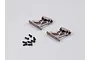 Two grey aluminium RC rear wing mounts with a set of small black screws on a plain light grey background.