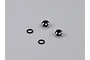 Two black aluminium LED light holders and two black rubber O-rings on a grey background.