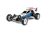 A Tamiya DT-03 Neo Fighter 2WD RC buggy kit, fully assembled with white and blue bodywork, white wheels, and off-road tires, isolated on a white background.