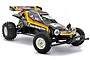 A Tamiya The Hornet 2004 1/10 scale RC buggy, featuring a black body with yellow and orange racing stripes, white wheels, and off-road tires.