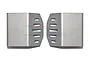 Two silver stainless steel gearbox skid plates for an RC car, featuring a vented design with five slots on each piece.