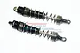 Two black aluminium RC shock absorbers with silver springs, branded with GPM logo, isolated on a white background.