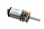 A Traxxas TRX-4 winch gearmotor featuring a silver metal motor housing, exposed brass and steel gear assembly, and a long output shaft.
