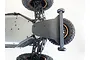 Bottom view of a Losi Lasernut XV4 RC car chassis featuring a black T-Bone Racing wheelie bar installed at the rear.
