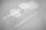 A clear, unpainted polycarbonate RC truck body shell for the HPI Jumpshot MT, shown from a high-angle studio perspective.