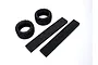Two black Kyosho Neo Bloc RC tyres and two rectangular black foam inserts arranged on a white background.