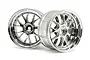 Two shiny chrome-plated RC car rims with a multi-spoke design, viewed from different angles against a white background.