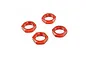 Four orange anodized aluminium serrated wheel nuts for RC cars arranged on a white background.