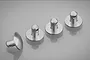 Four silver aluminium RC body shell posts arranged on a reflective grey surface.