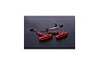 Two orange anodized aluminium LED tail light bars for an RC vehicle, each with five small LEDs and wiring harnesses.