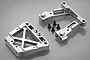 Two silver aluminium RC rear bulkhead components with four black screws on a grey background.