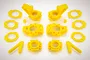 A set of bright yellow Rovan RC car suspension parts including hub carriers, rings, and arms arranged on a white background.