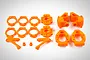 A set of bright orange Rovan RC car suspension parts including hub carriers, rings, and arms arranged on a white background.